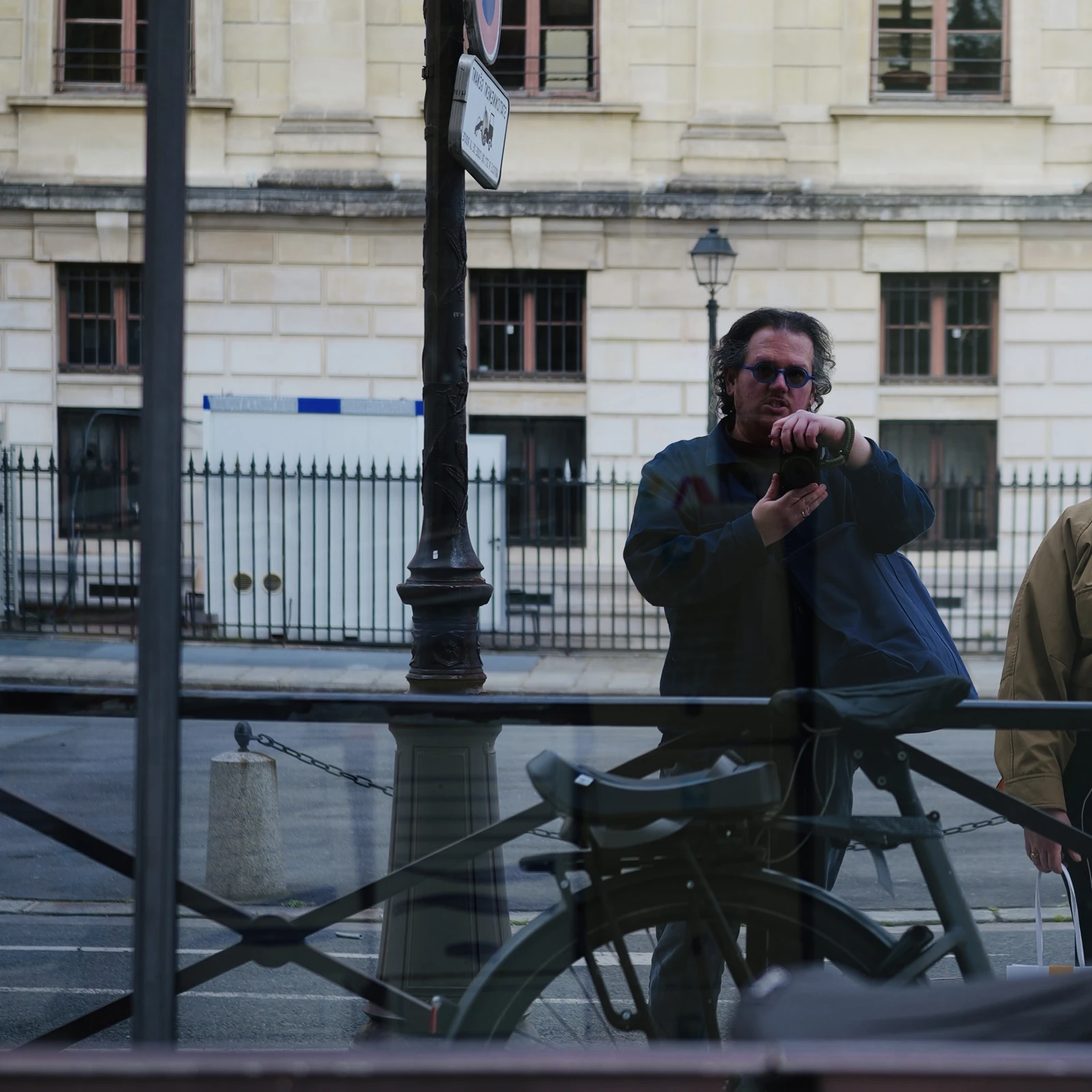 Josh taking a photograph of his reflection in a window